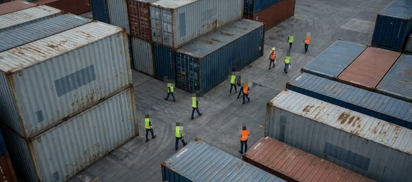 industrial site with anonymised people in the imagery